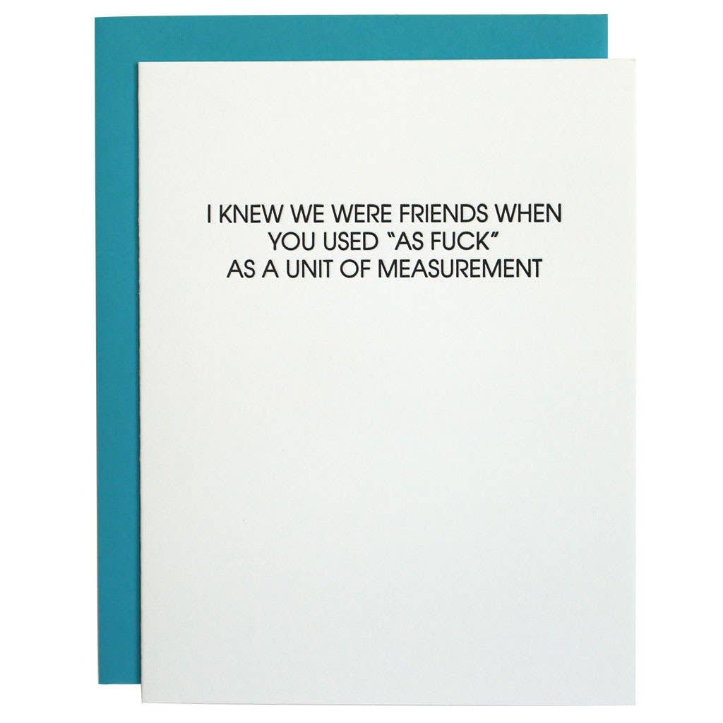 White card with black text stating "I knew we were friends when you used 'as fuck' as a unit of measurement". Fluorescent blue envelope.