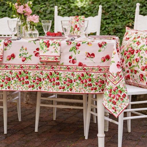 Tablecloth in pink with red strawberries and green leaves