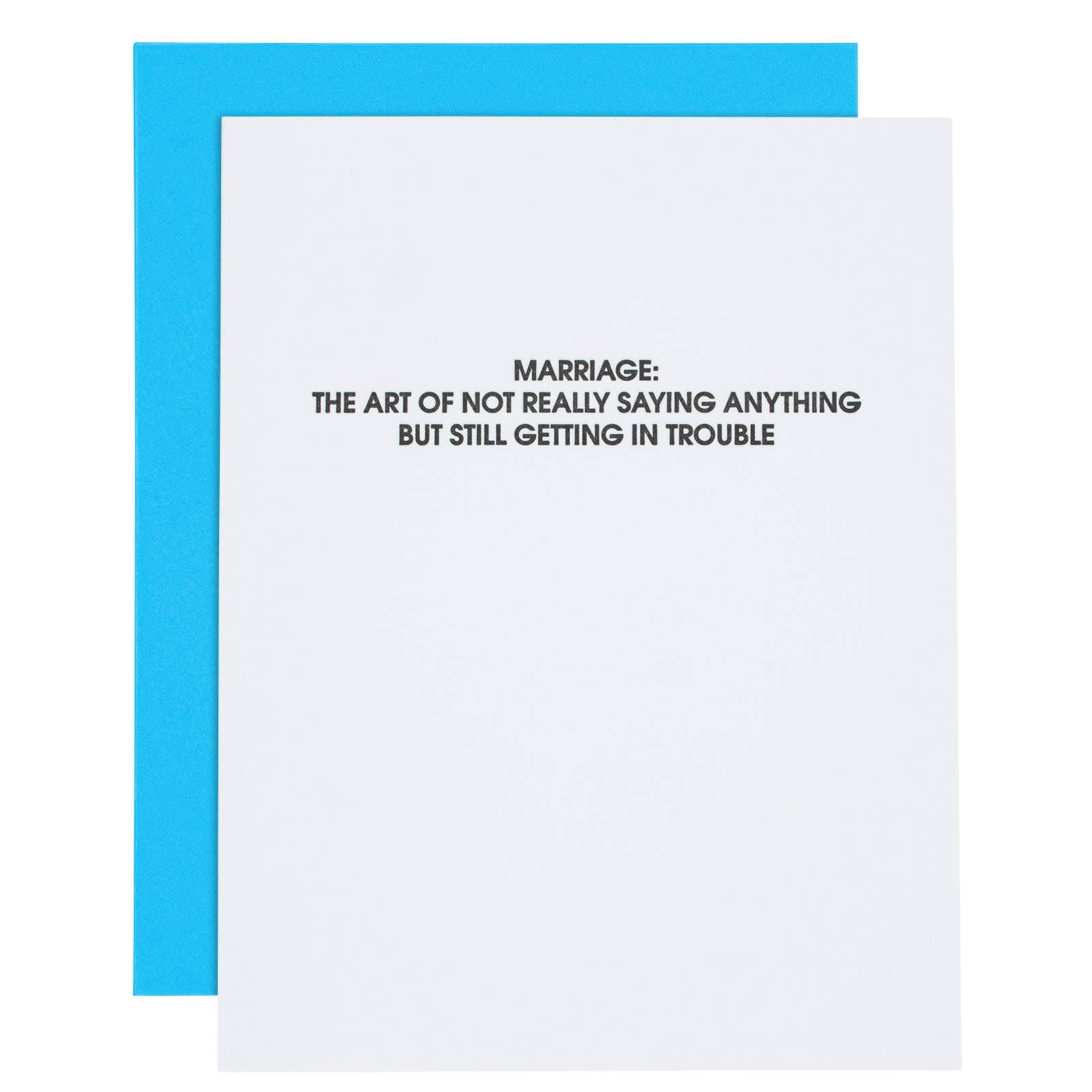 White card with black text " Marriage: the art of not really saying anything but still getting in trouble". Fluorescent blue envelope.