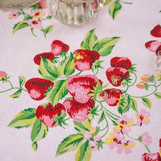 Tablecloth in pink with red strawberries and green leaves