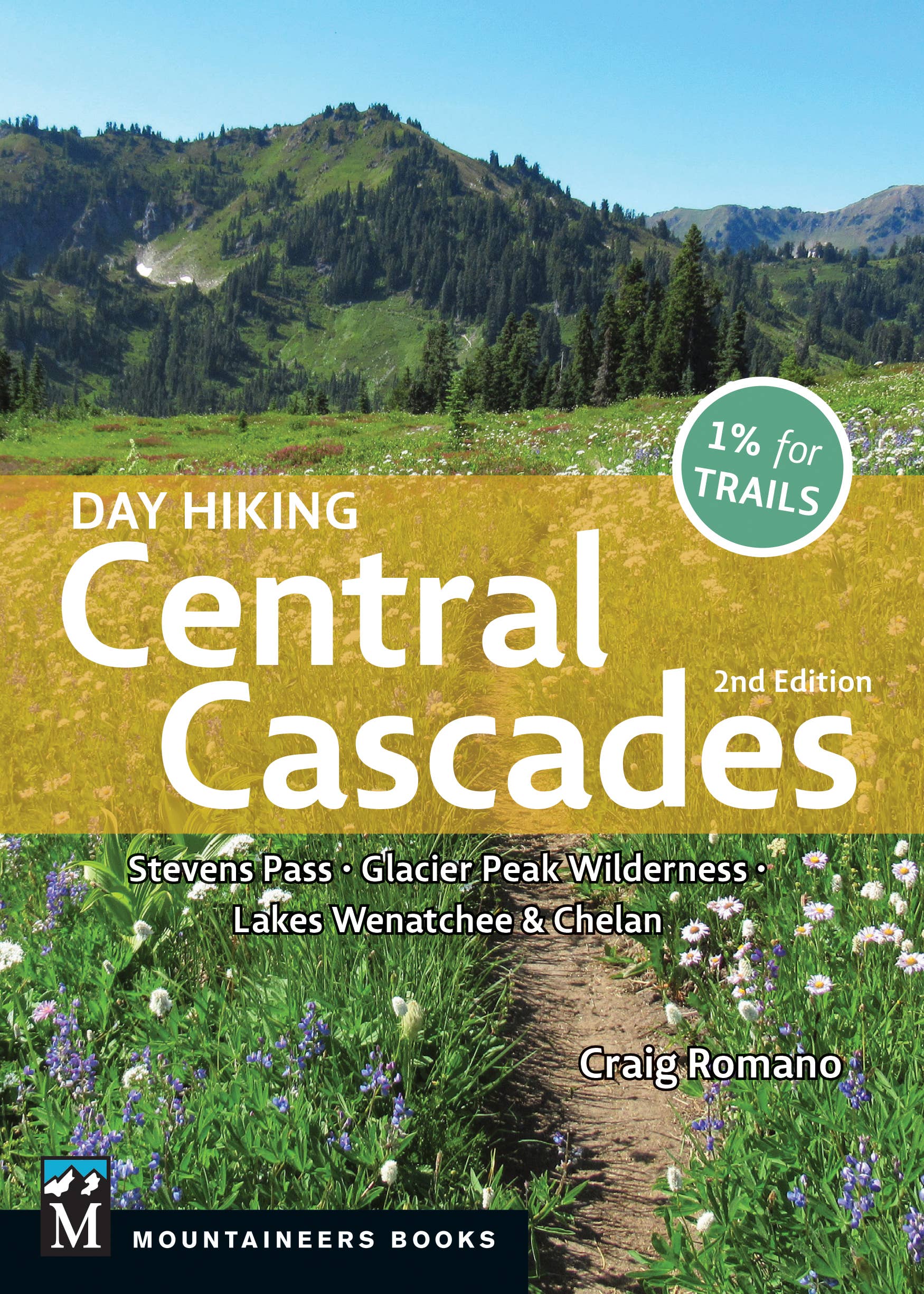 Front cover of "Day Hiking Central Cascades 2nd Edition" by Craig Romano background picture of a meadow and mountain trail in Cascades. 