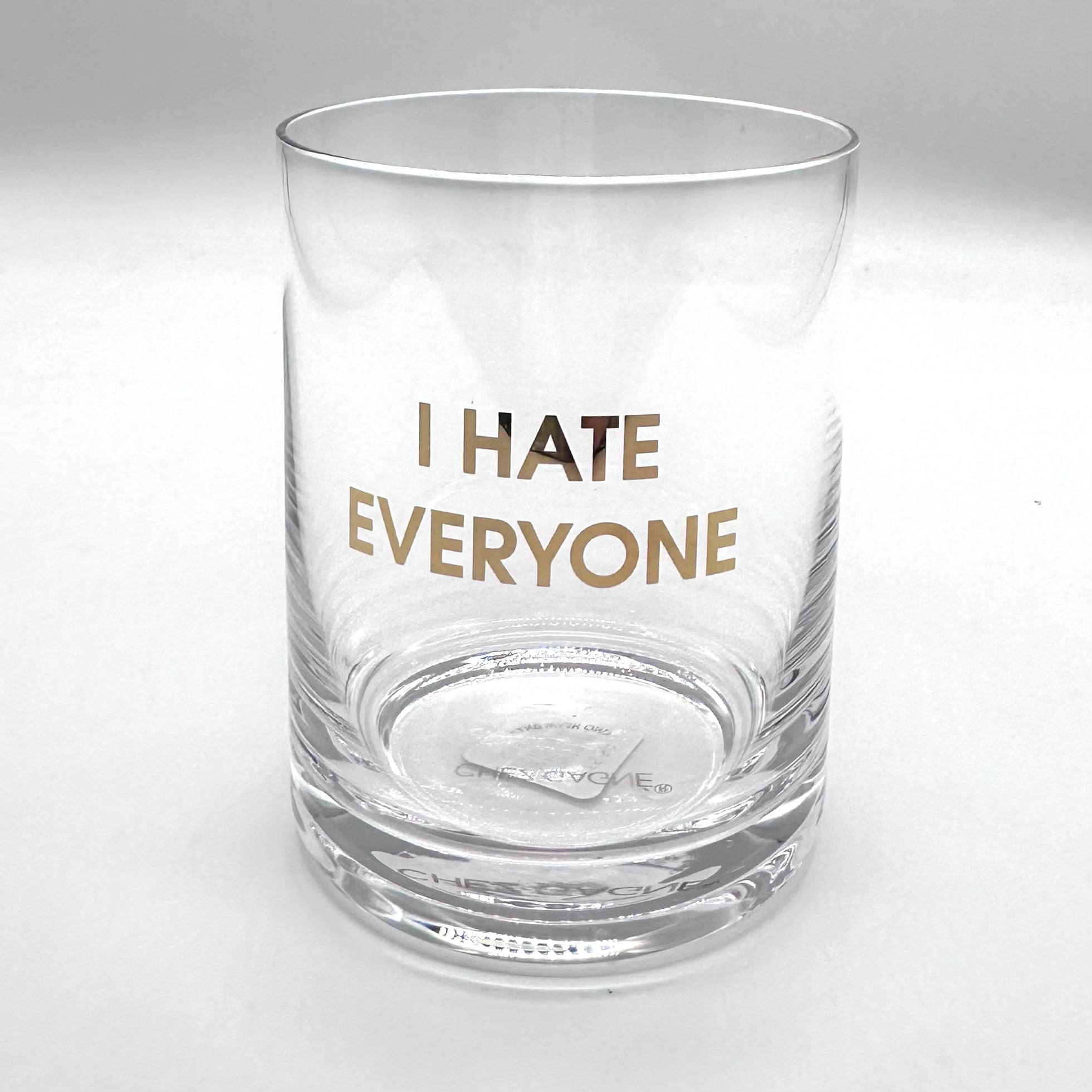 Clear rocks glass with "I HATE EVERYONE" in gold lettering.