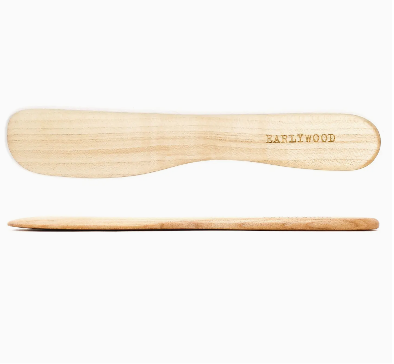 Maple wood spreader with wide sturdy edge and minimalist design.