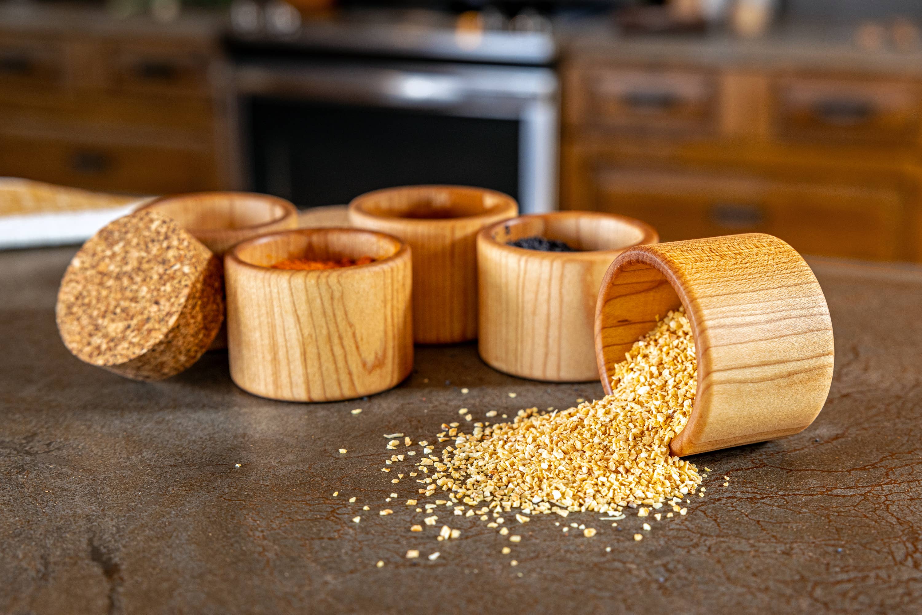 Maple wood round cups for salt cellar or spices.  Cork top to keep contents fresh. one cup on its side to reveal spices