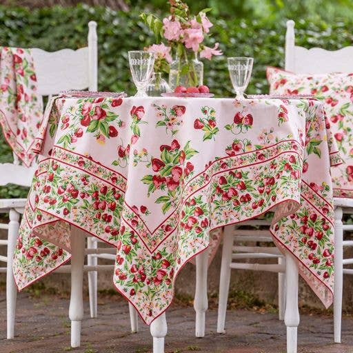 Tablecloth in pink with red strawberries and green leaves