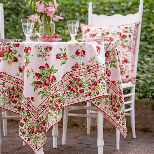 Tablecloth in pink with red strawberries and green leaves