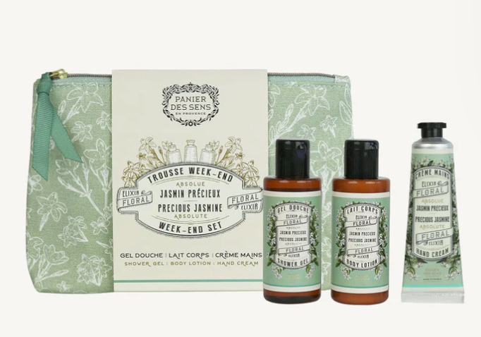 mage of Panier Des Sens week-end set.  Three travel sized Jasmin scented products in a green and white floral bag. Shower gel and body cream in brown bottles with black id and green jasmine floral print on logo. Hand cream in green tube with jasmine flower pattern and black cap. 